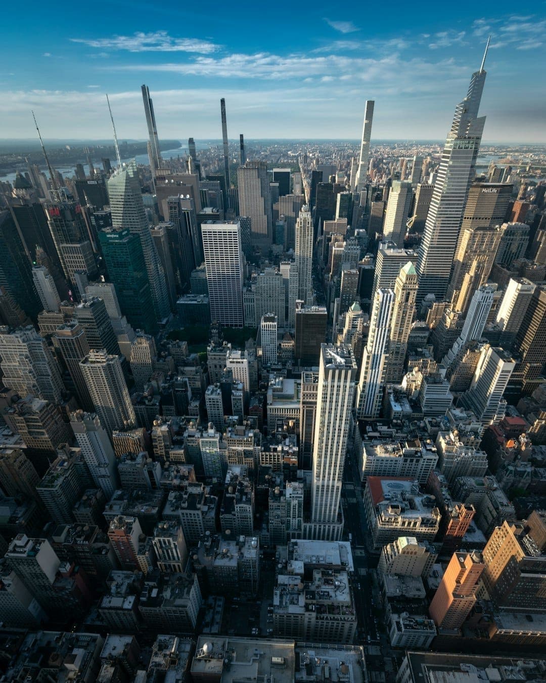 Aerial view of Midtown Manhattan with the Empire State Building visible in the dense skyline