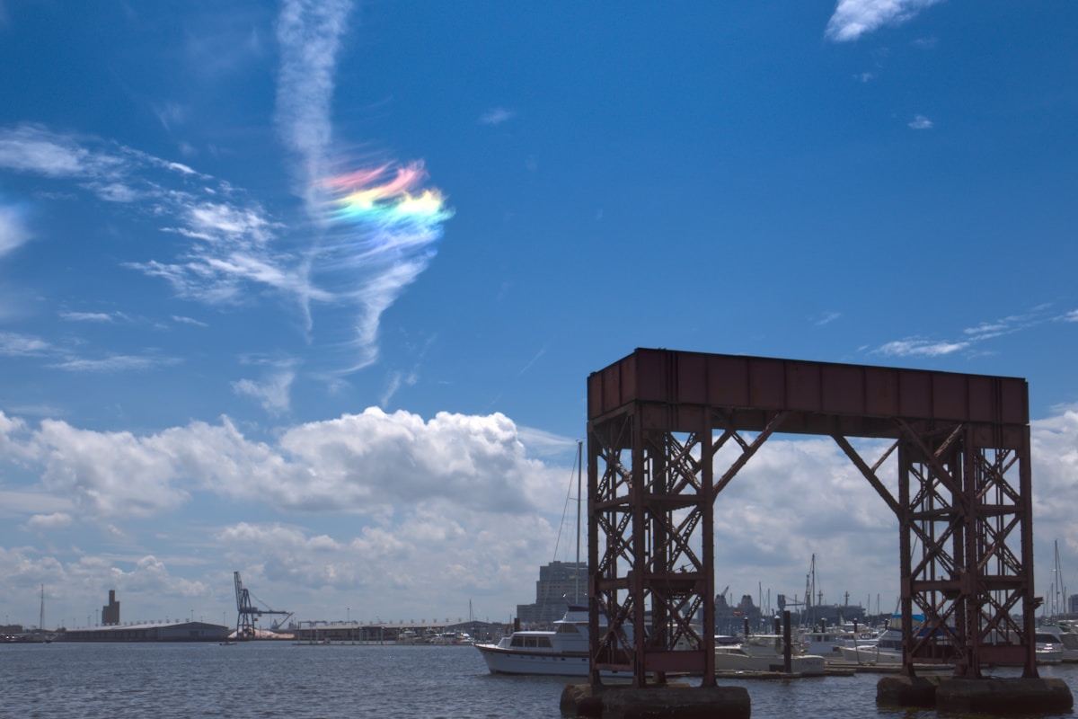 Industrial archway over water with boats, Baltimore Inner Harbor, Maryland