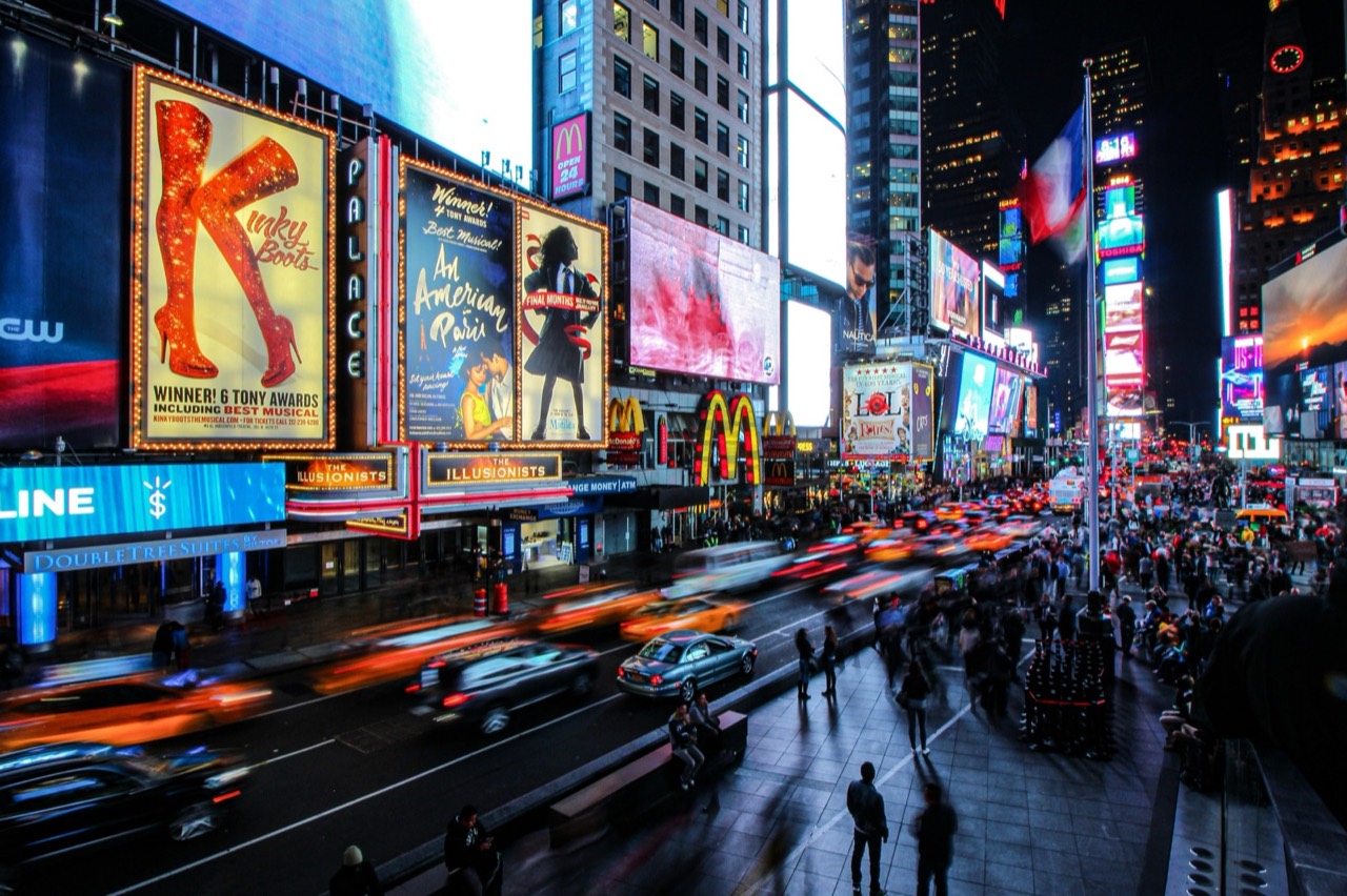 People walking on Times Square at night, New York City, USA