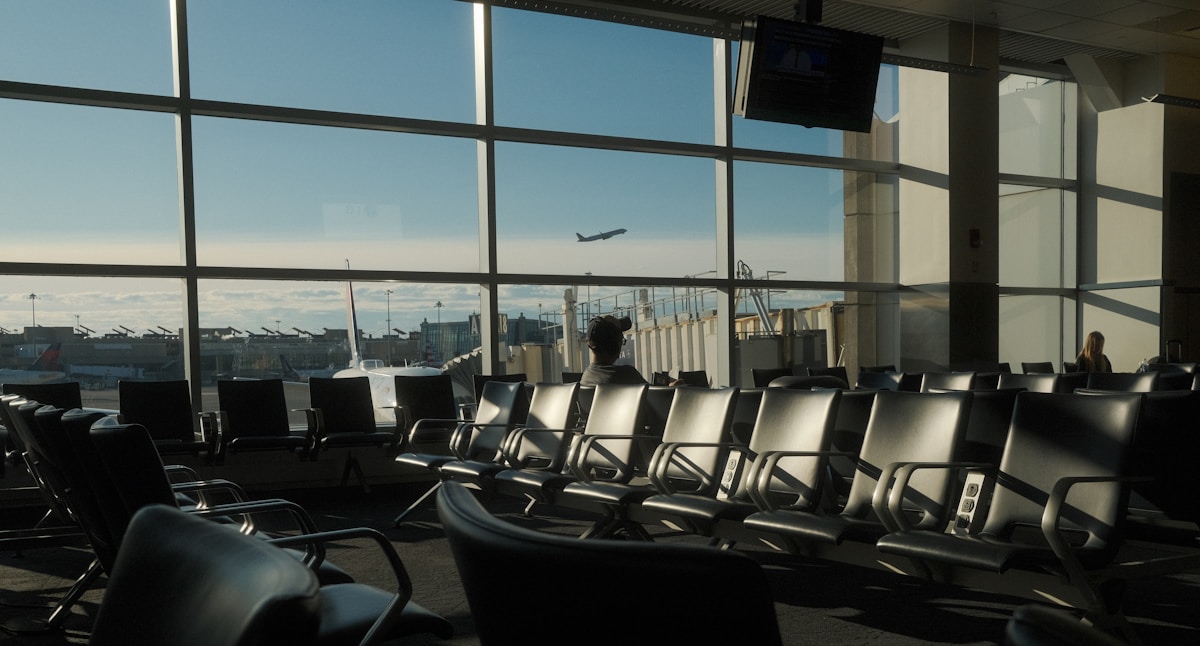 Airplane taking off from Boston Logan International Airport terminal, Massachusetts