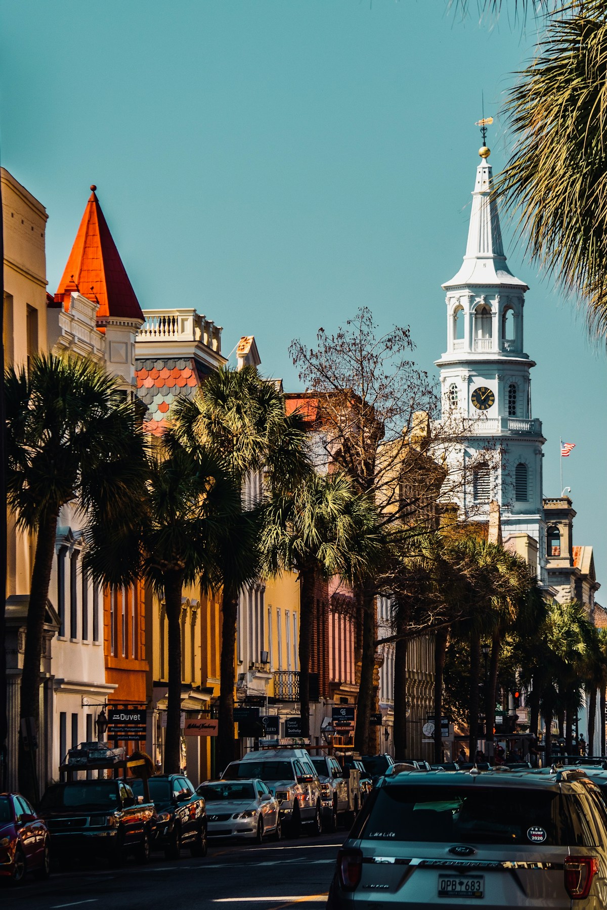 City street with a church steeple in the background, Charleston, South Carolina