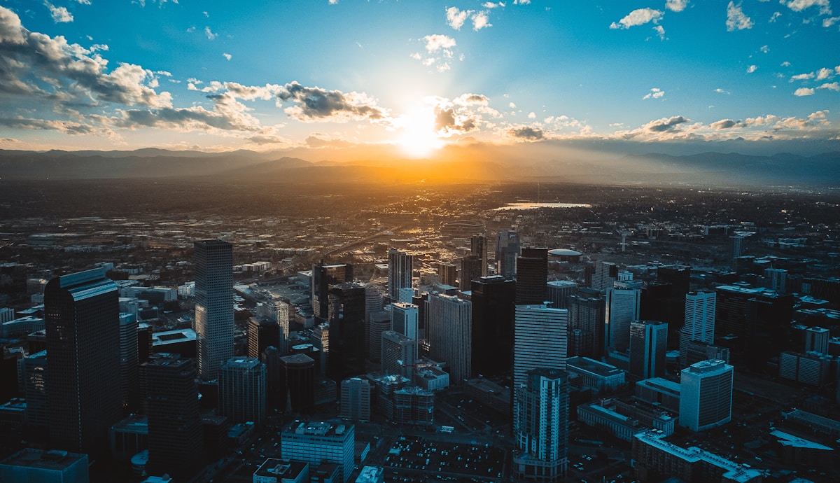 Phoenix skyline at sunset with the Sonoran Desert and saguaro cacti in the foreground