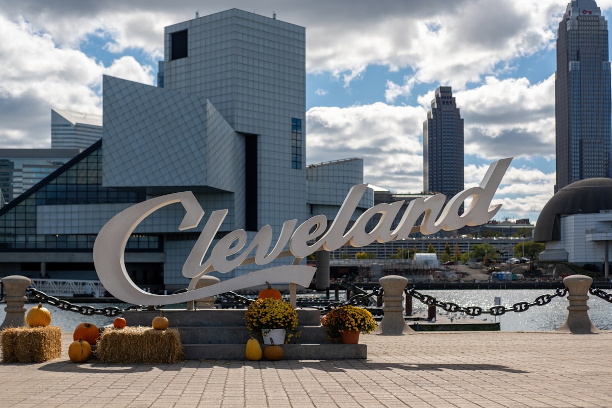 Cleveland sign with modern buildings and autumn decorations, Ohio