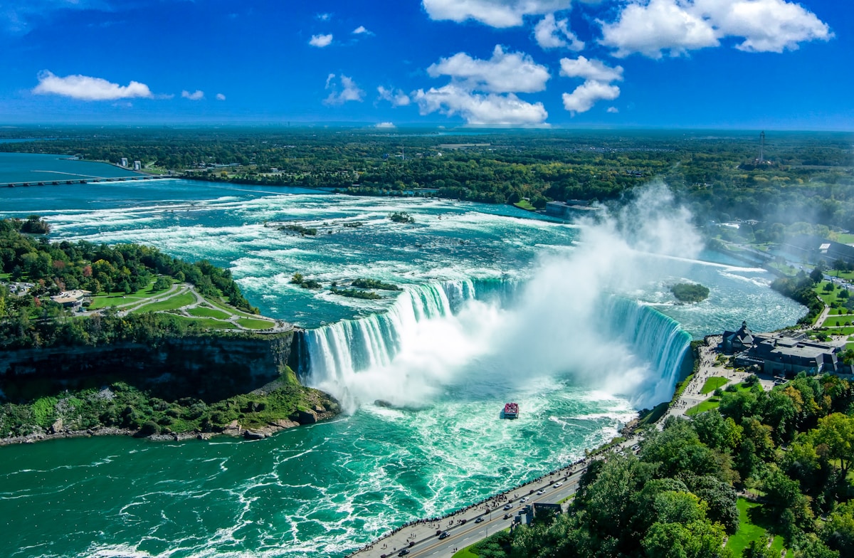 Aerial view of Horseshoe Falls at Niagara with Maid of the Mist boat in the mist