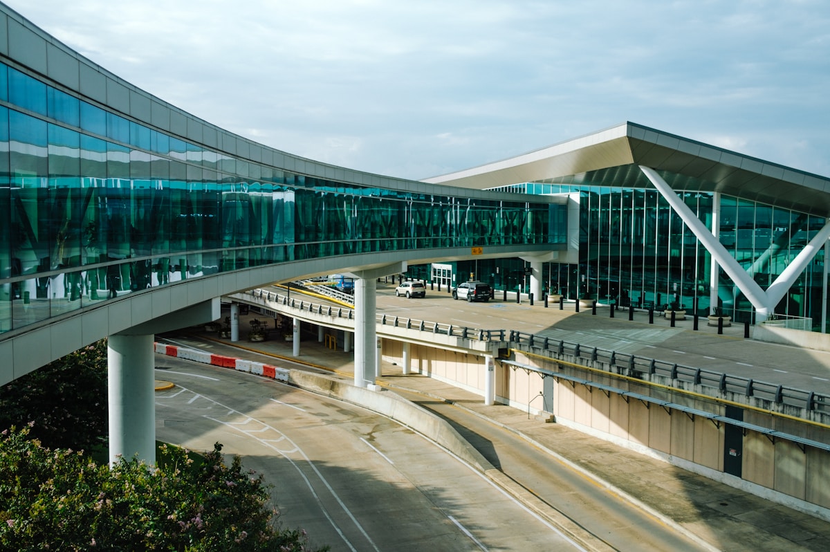 Curved walkway leading to a terminal at George Bush Intercontinental Airport, Houston, Texas