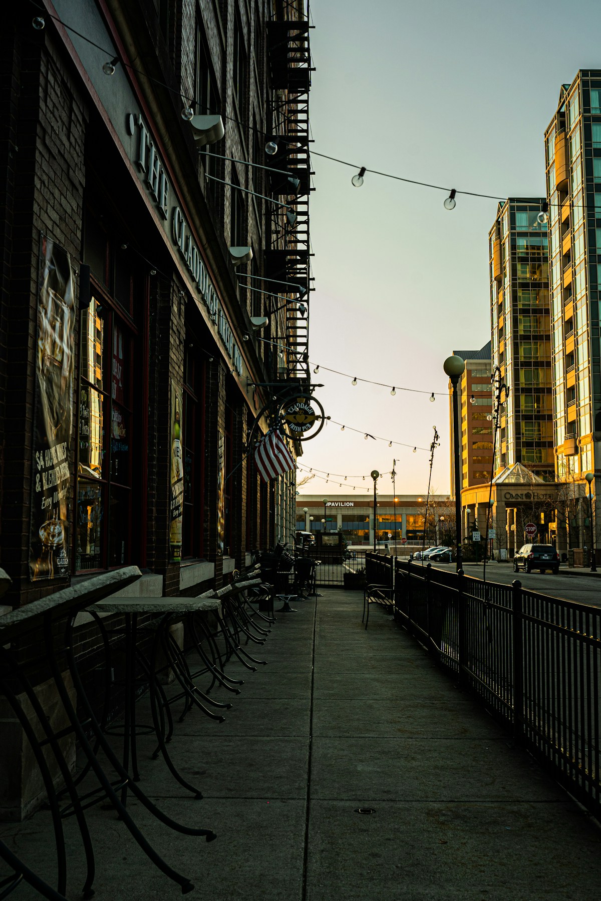 Outdoor cafe with black metal chairs and tables on sidewalk, Indianapolis, Indiana