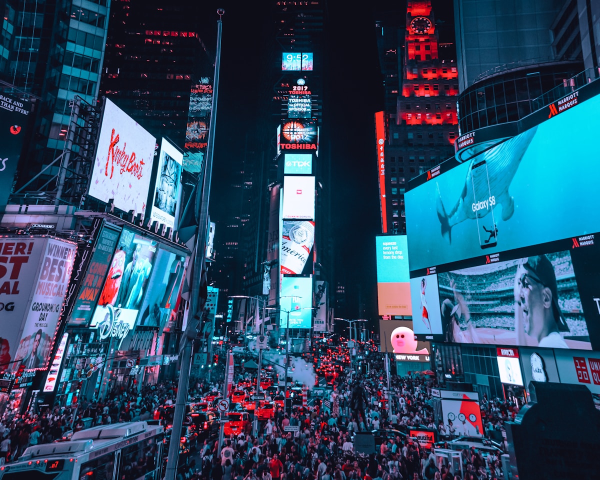 Times Square billboards and crowds at night, New York City