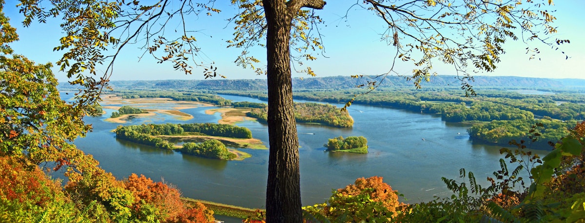 Green countryside and river bluffs near the Kansas City area, Iowa border