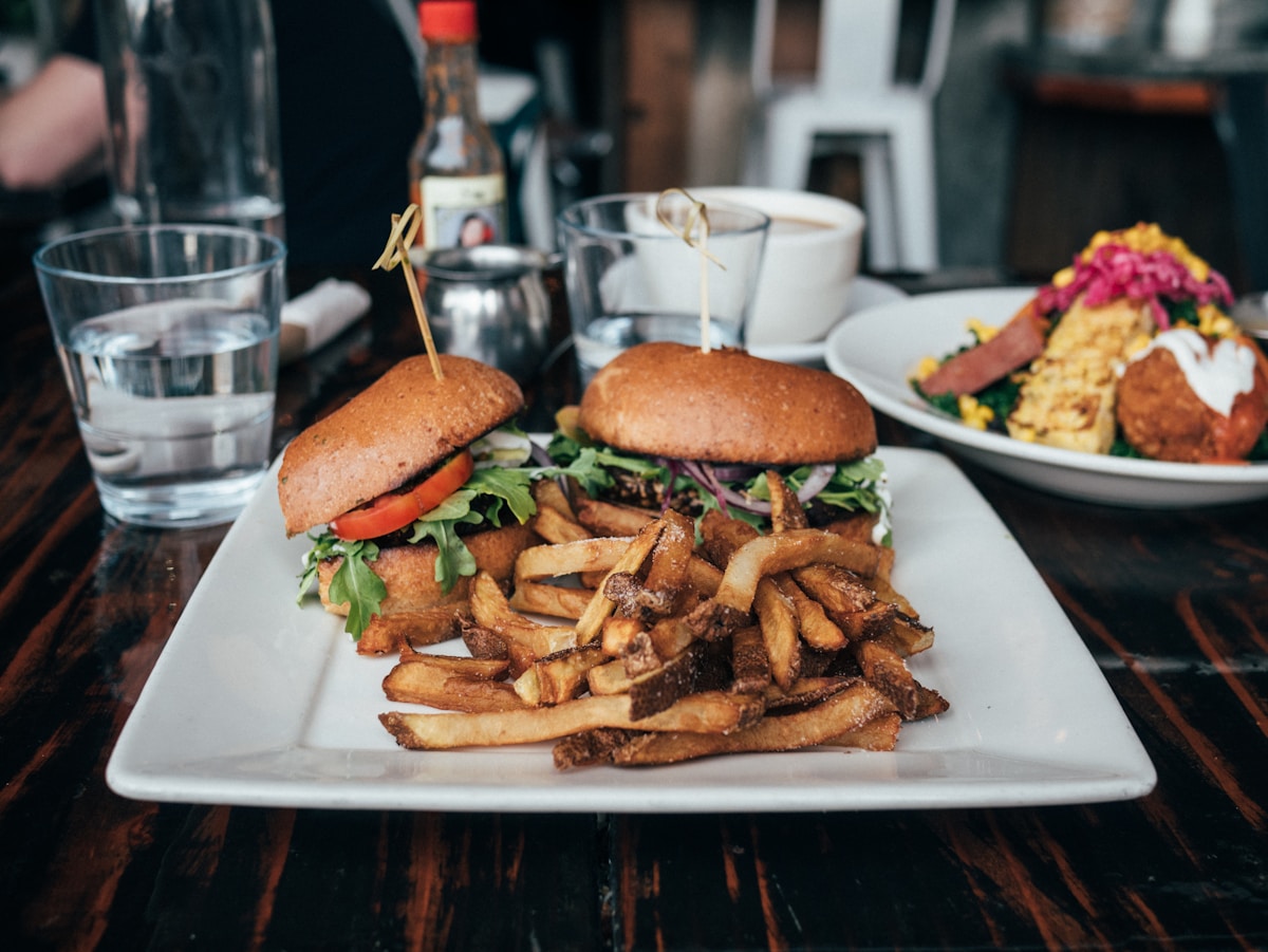 Plant-based burgers and fries at Sage Plant Based Bistro, Los Angeles