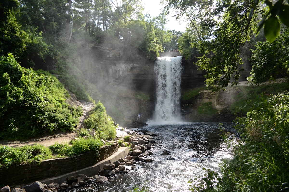 Minnehaha Falls cascading over rocks surrounded by lush greenery, Minneapolis, Minnesota