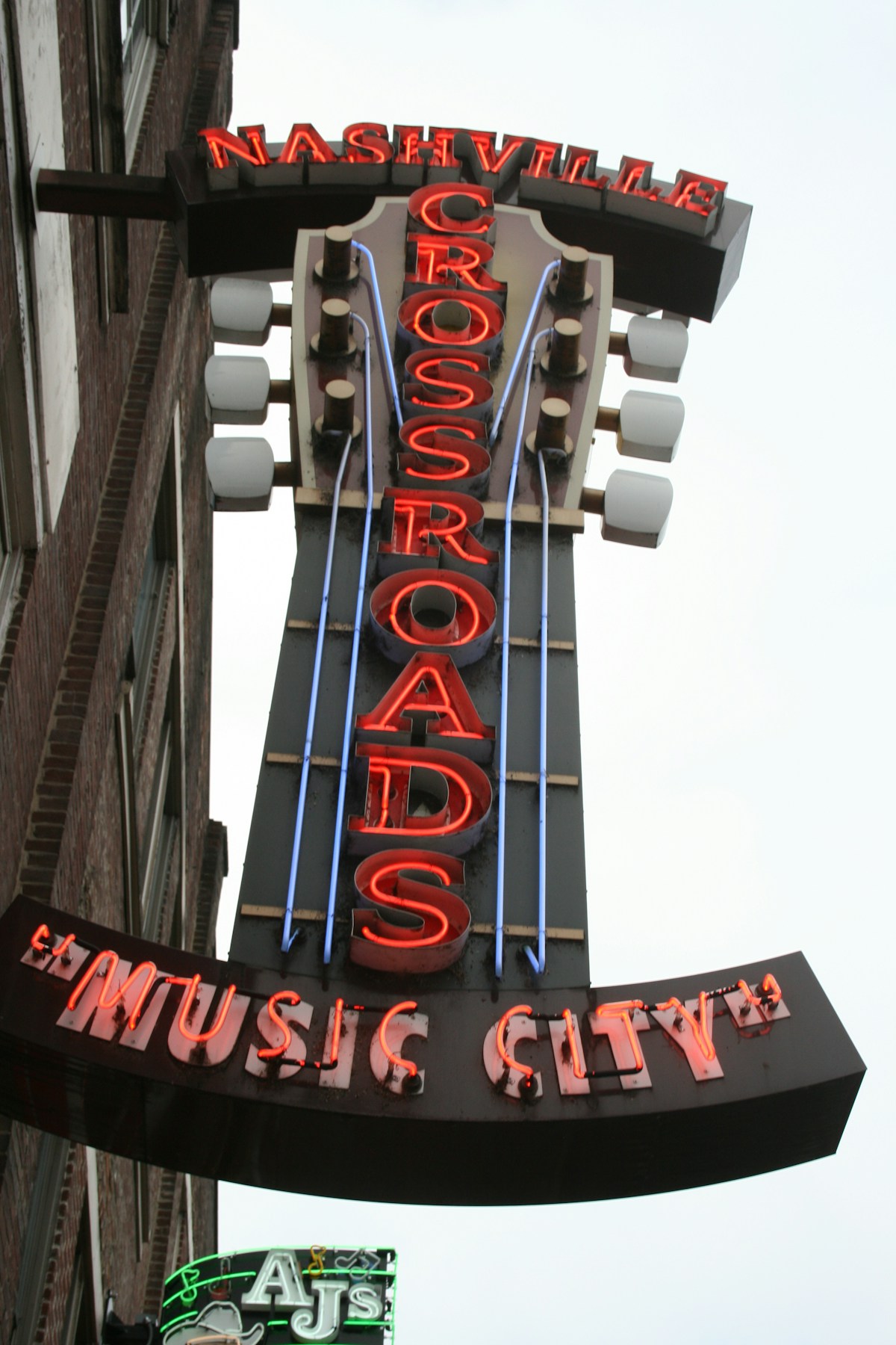 Glowing neon honky-tonk sign on a building on Broadway, Nashville, Tennessee