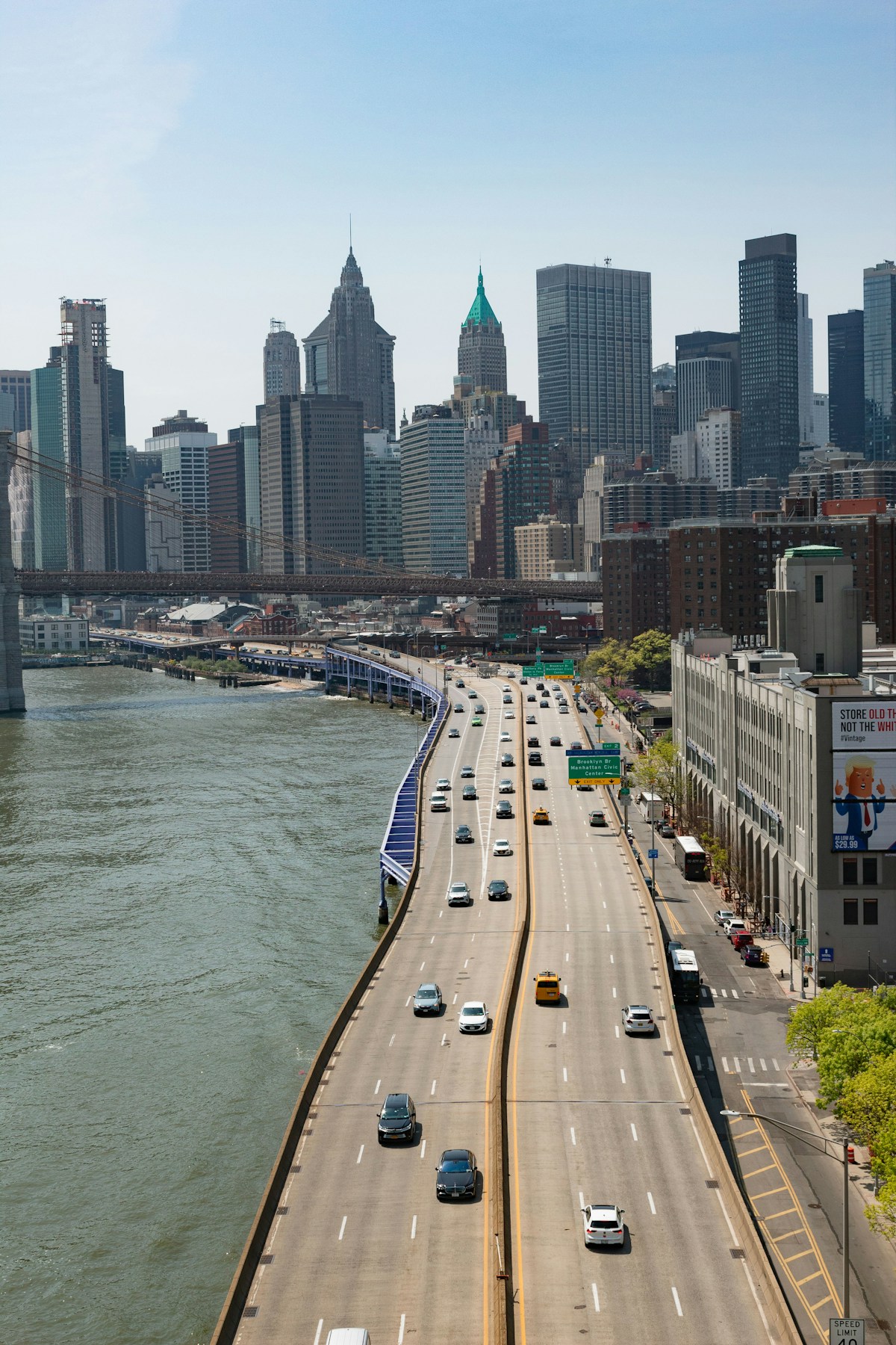 Vehicles on FDR Drive highway with New York City skyline in background