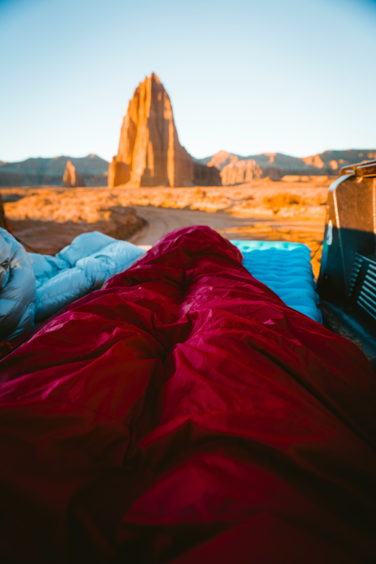 Camping scene overlooking the towering sandstone monoliths of Cathedral Valley, Capitol Reef National Park, Utah