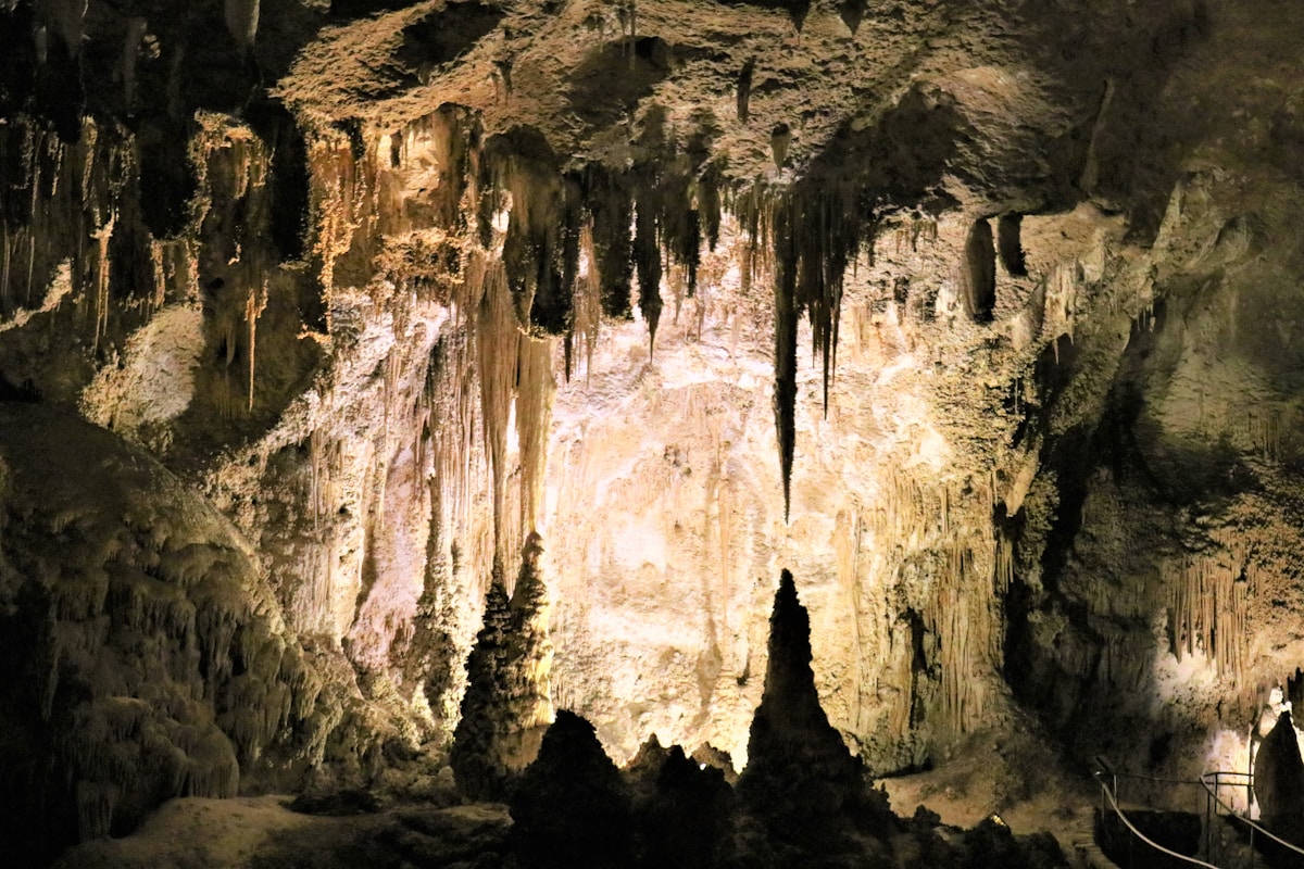 Dramatic cave interior with stalactites and stalagmites illuminated in Carlsbad Caverns National Park, New Mexico
