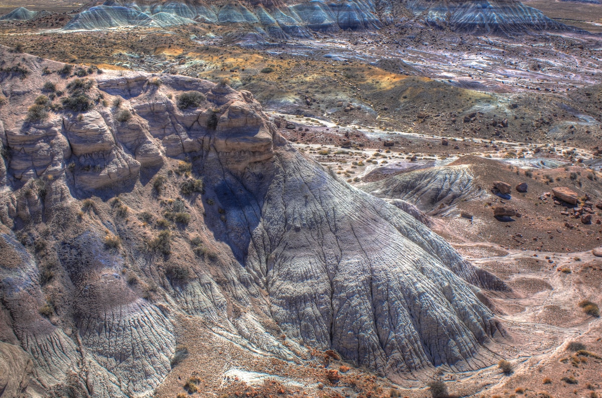 Colorful layered Blue Mesa badlands with purple, gray, and red banded rock formations, Petrified Forest National Park, Arizona