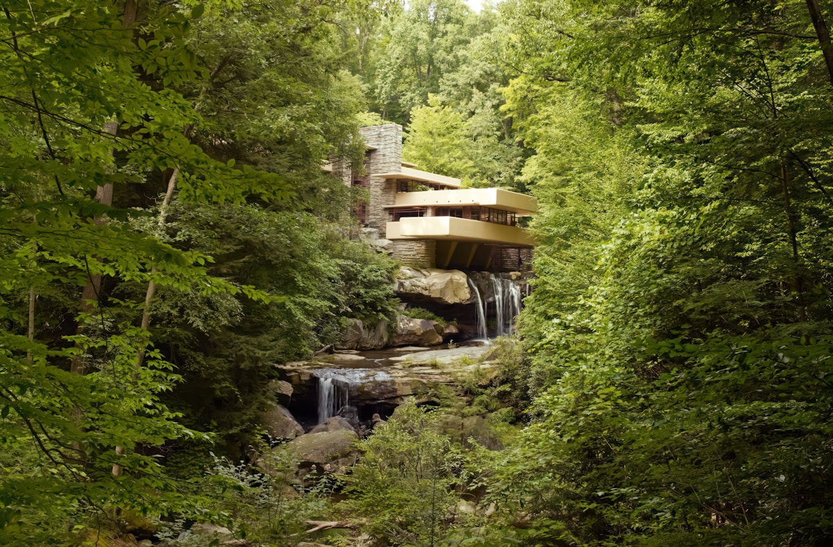 Fallingwater house cantilevered over a waterfall in the Pennsylvania forest