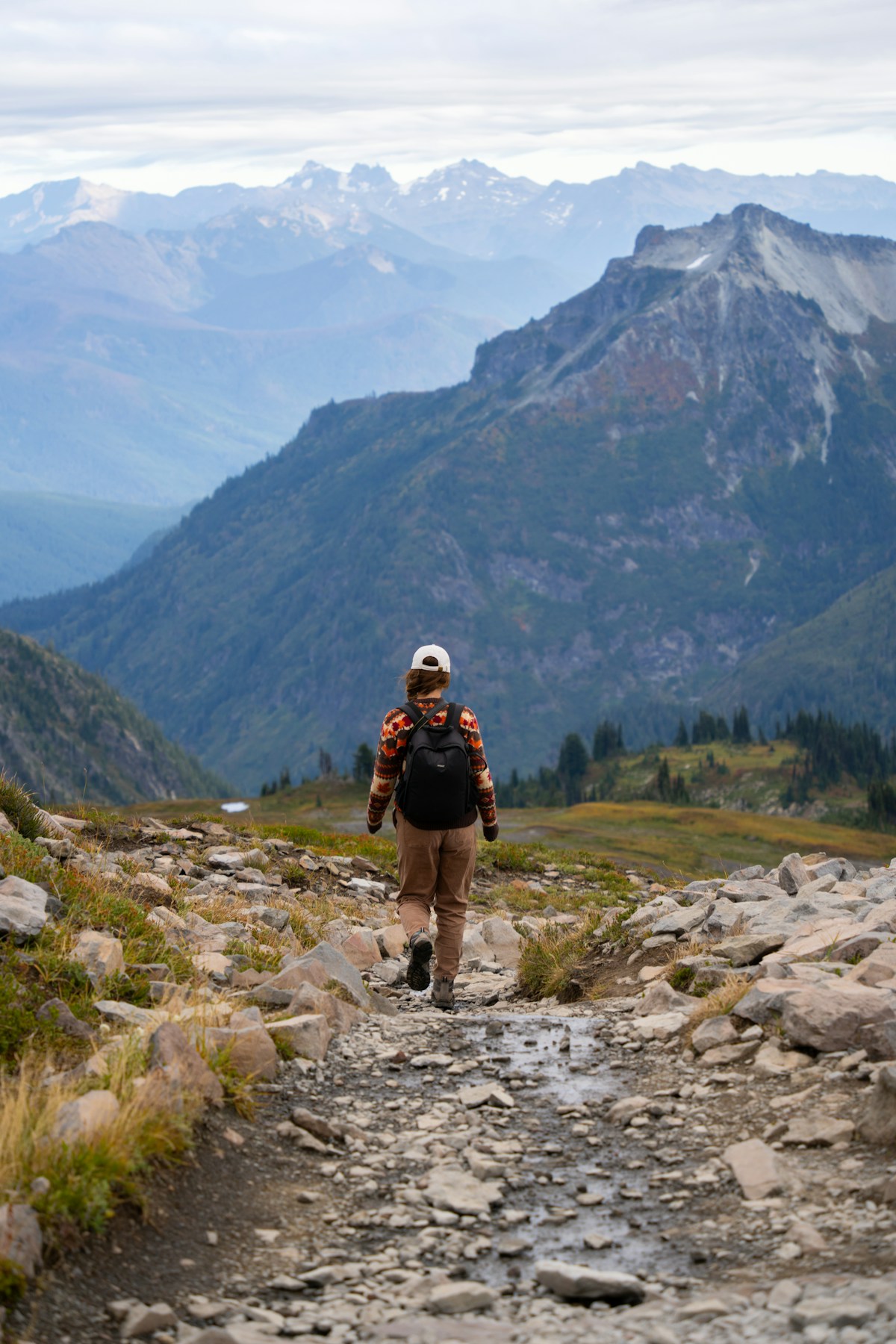 Hiker on a mountain trail with panoramic views in the American West