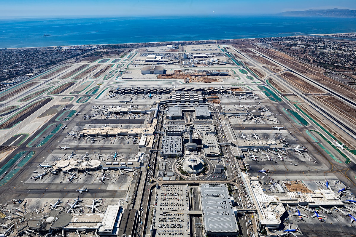 Aerial view of Los Angeles International Airport (LAX) with runways and Pacific Ocean