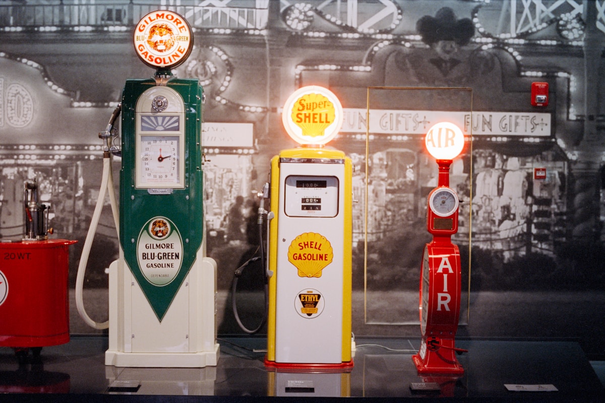 Restored vintage American gasoline pumps with illuminated globes