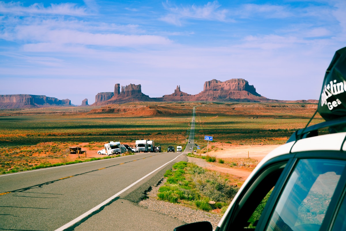 Road trip through Monument Valley with RVs on the famous US-163 scenic highway, Utah
