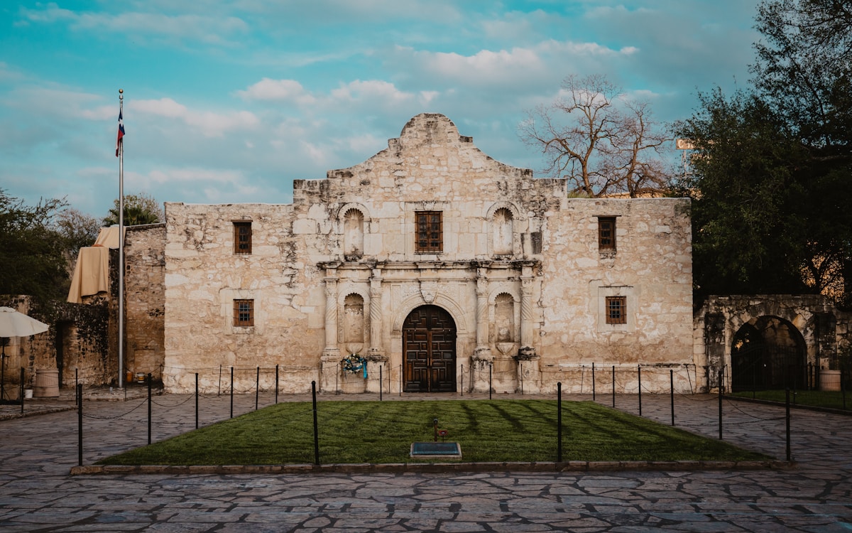 The Alamo historic mission building under blue sky in downtown San Antonio, Texas