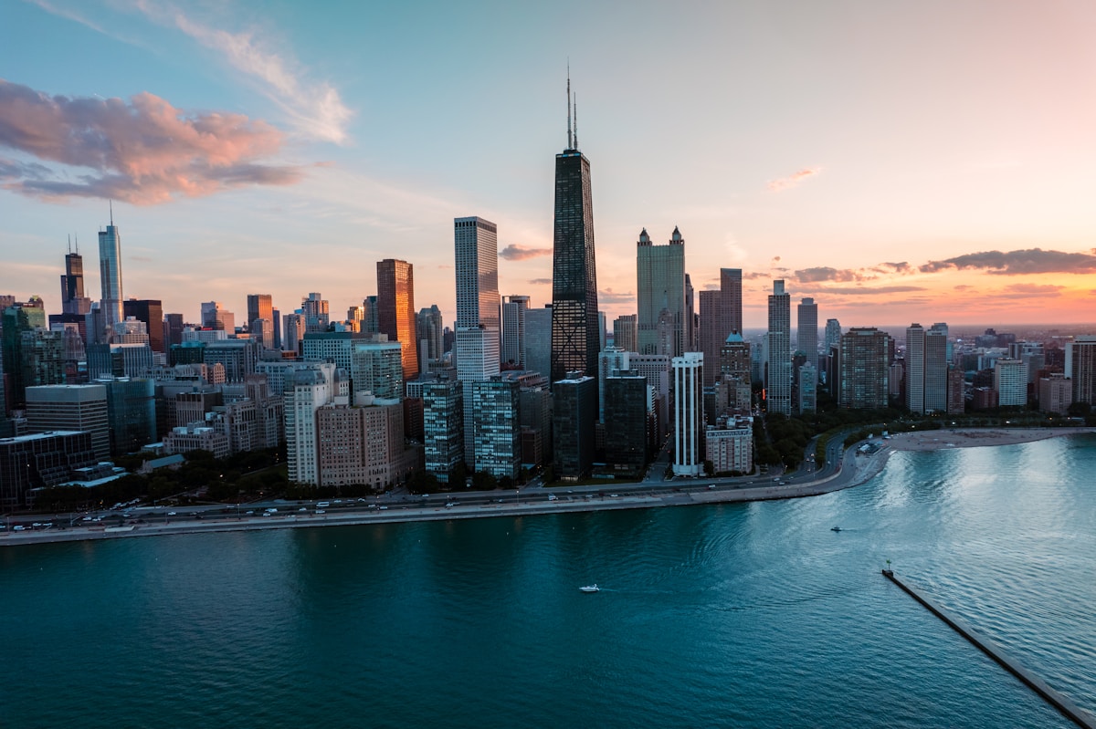 Chicago city skyline with John Hancock building and Lake Michigan at sunset, Illinois