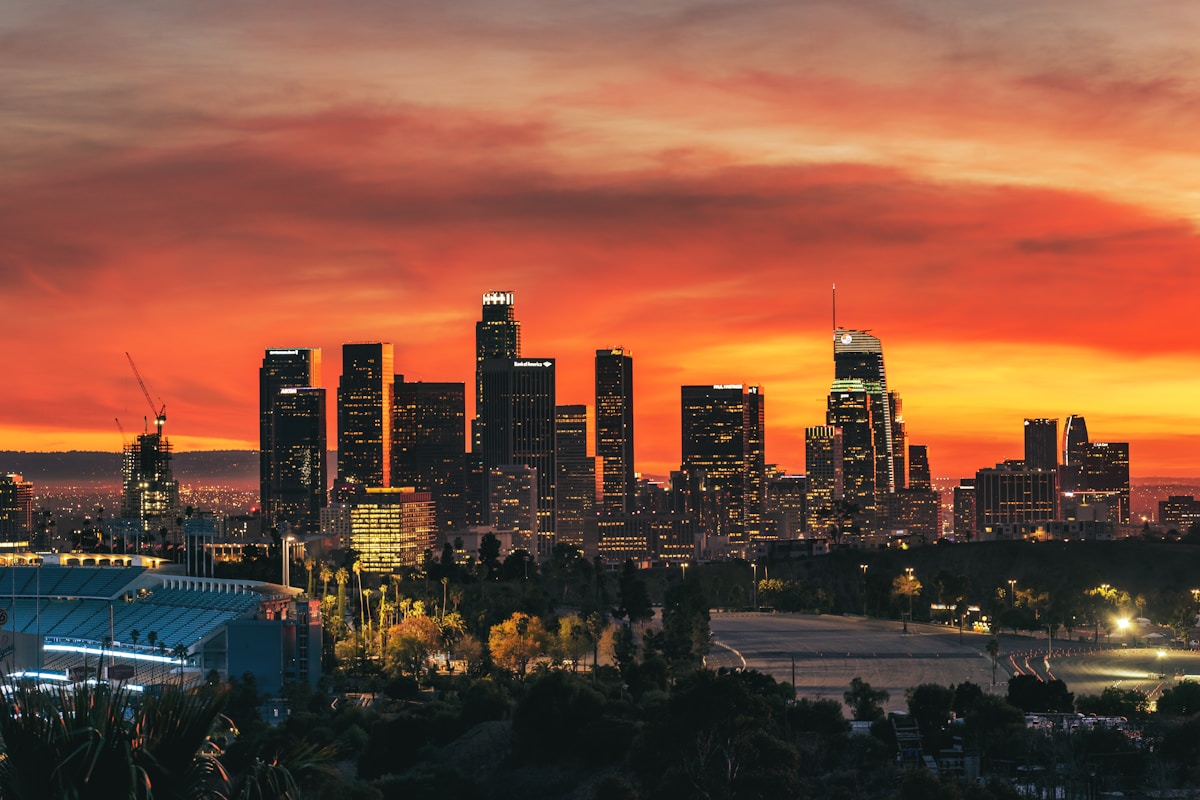 Downtown Los Angeles skyline at sunset with a fiery orange sky, California