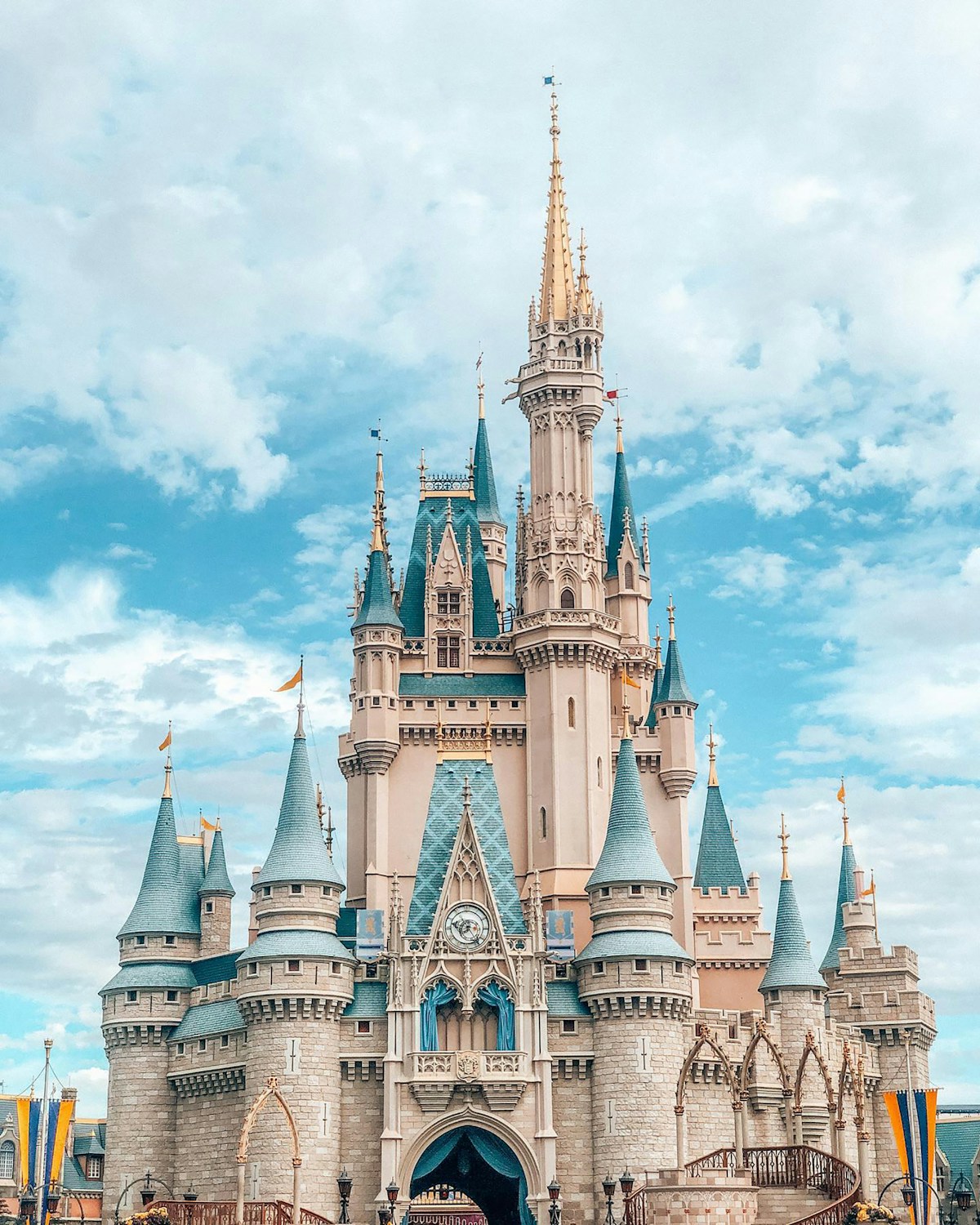 Cinderella Castle at Walt Disney World Magic Kingdom under blue sky, Orlando, Florida