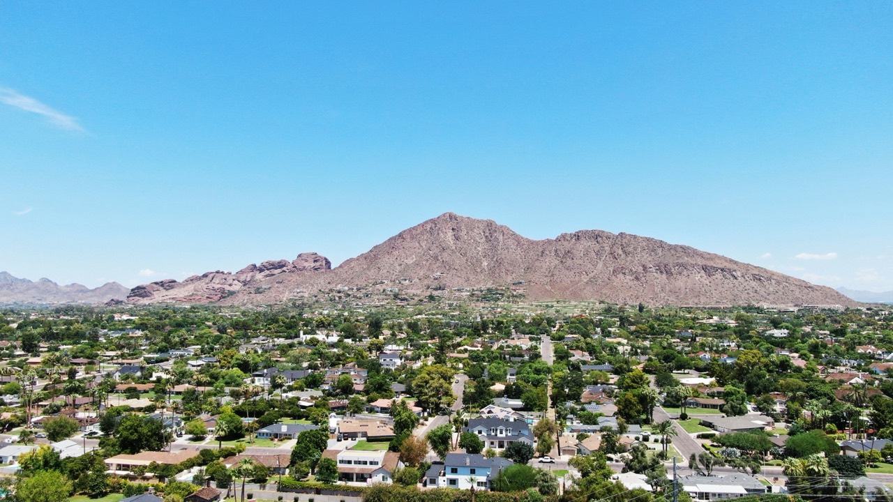 Aerial view of Phoenix city buildings with desert surroundings, Arizona