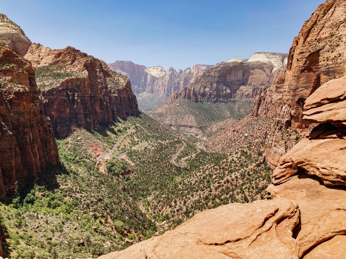 View from Canyon Overlook looking down the length of Zion Canyon, with red sandstone walls and the winding road below, Zion National Park, Utah